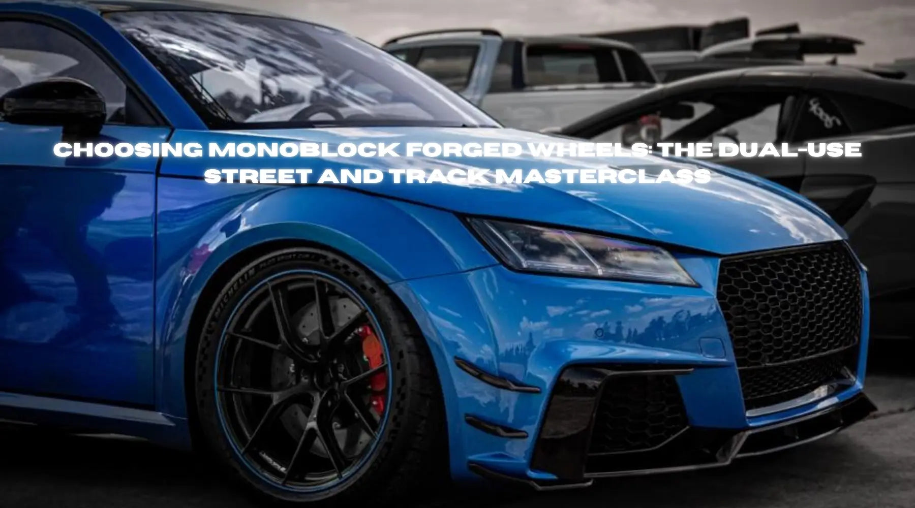 RRT Forged wheel with aggressive track tire setup on pit lane.