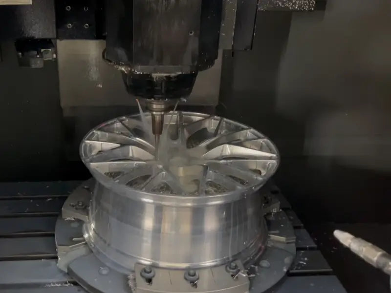 5-axis CNC machine cutting custom 6061-T6 forged wheels